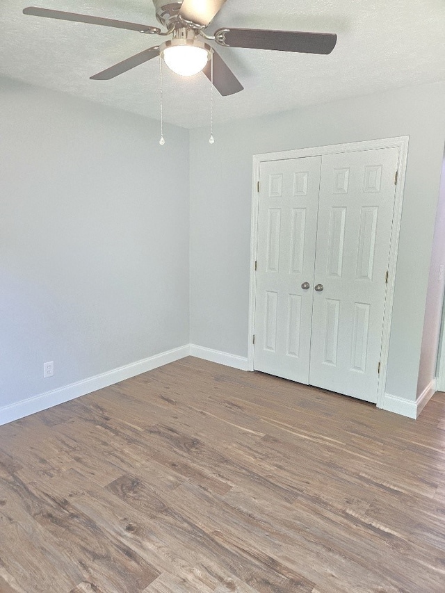 4044 Castlewood Pkwy, Columbus, GA 31907 - unfurnished bedroom featuring wood finished floors, baseboards, and a closet