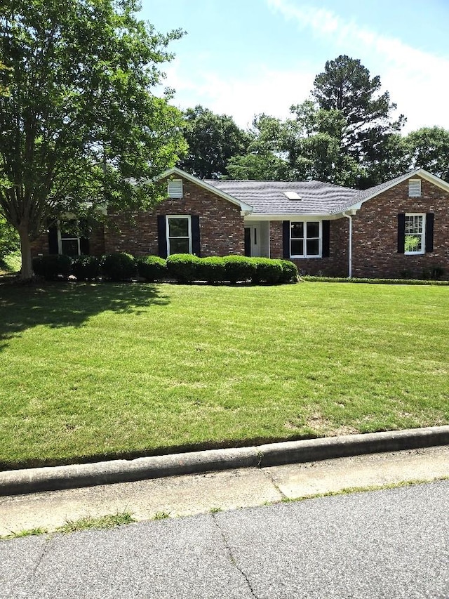 4044 Castlewood Pkwy, Columbus, GA 31907 - view of front of home featuring a front lawn and brick siding