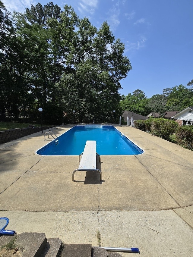 4044 Castlewood Pkwy, Columbus, GA 31907 - outdoor pool featuring a diving board and a patio
