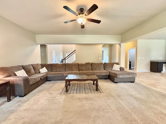 3814 Pond View Ct, Columbus, GA 31907 - living area with light colored carpet, a ceiling fan, and stairs