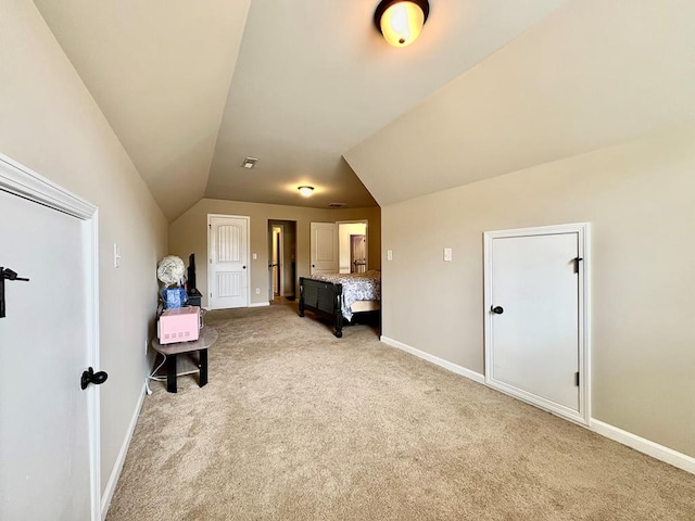 3814 Pond View Ct, Columbus, GA 31907 - bedroom featuring light colored carpet, vaulted ceiling, and baseboards