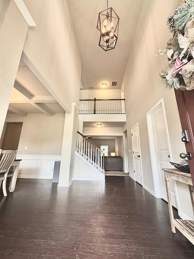 3814 Pond View Ct, Columbus, GA 31907 - entryway with a high ceiling, stairway, hardwood / wood-style flooring, a chandelier, and a wainscoted wall