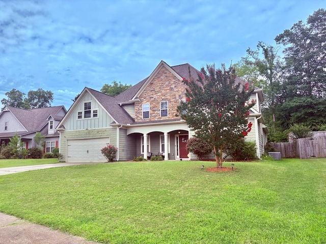3814 Pond View Ct, Columbus, GA 31907 - craftsman house with covered porch, board and batten siding, driveway, a garage, and stone siding
