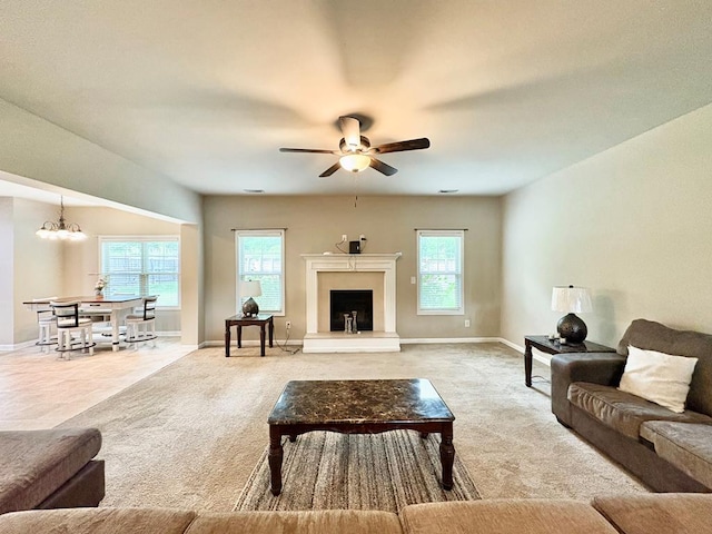 3814 Pond View Ct, Columbus, GA 31907 - living room featuring light carpet, a ceiling fan, baseboards, and healthy amount of natural light
