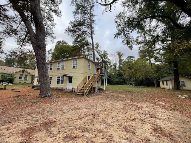 1800 18th Ct, Phenix City, AL 36867 - back of house featuring stairs and an outdoor structure