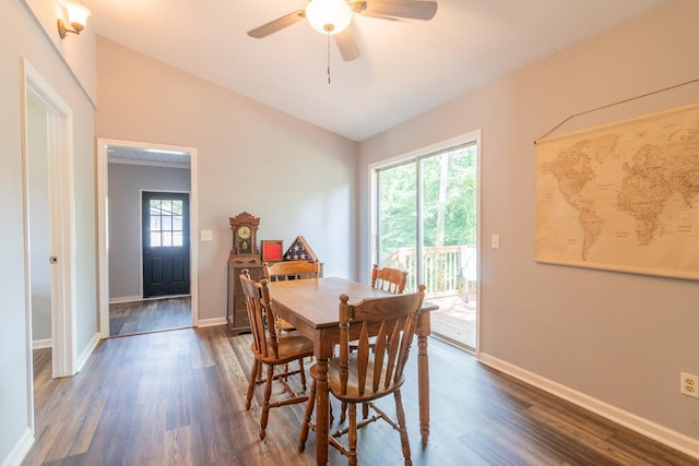 dining area featuring dark hardwood / wood-style floors, a wealth of natural light, lofted ceiling, and ceiling fan