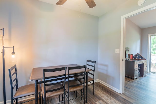 dining area featuring hardwood / wood-style flooring and ceiling fan