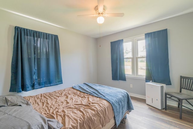 bedroom featuring ceiling fan and hardwood / wood-style floors