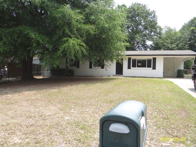 1520 Barcelona Dr, Columbus, GA 31907 - view of front of house featuring a front yard, an attached carport, and driveway