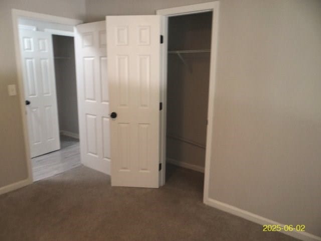 1520 Barcelona Dr, Columbus, GA 31907 - unfurnished bedroom with carpet, a walk in closet, and a closet