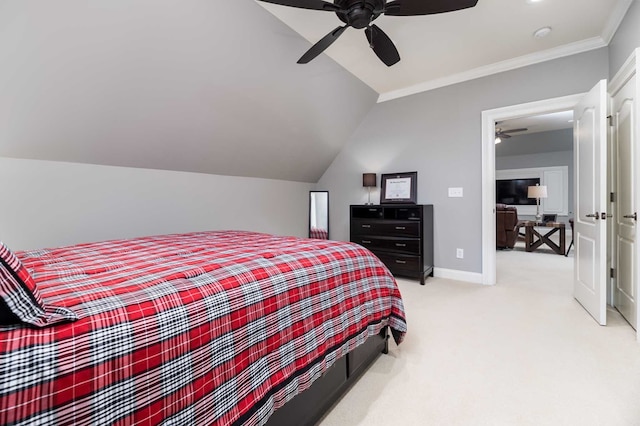 bedroom with light carpet, ceiling fan, vaulted ceiling, and ornamental molding