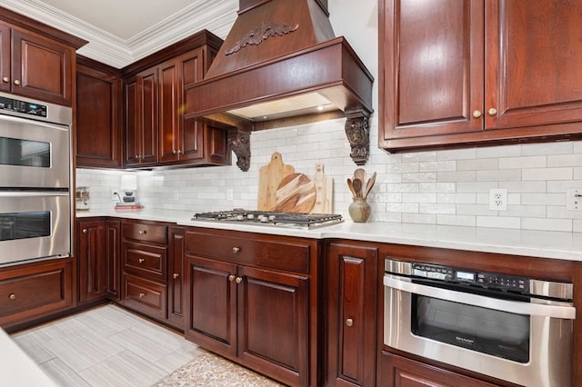 kitchen featuring custom range hood, backsplash, appliances with stainless steel finishes, and crown molding