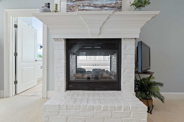 interior details with carpet and a fireplace