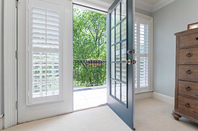 doorway to outside with light colored carpet, ornamental molding, and french doors