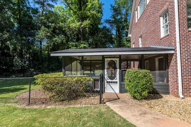 entrance to property with a yard