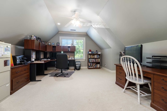 carpeted home office with ceiling fan and vaulted ceiling