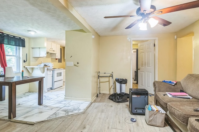 2871 Barbara Rd, Columbus, GA 31907 - living room with light wood-type flooring, ceiling fan, and a textured ceiling