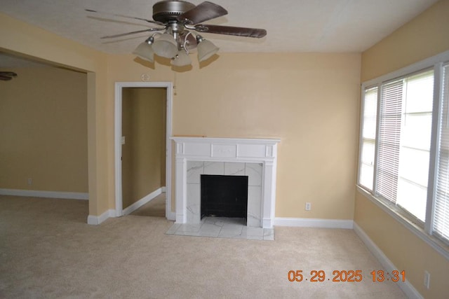 3836 Mulberry Dr, Columbus, GA 31907 - unfurnished living room featuring carpet flooring, a tiled fireplace, ceiling fan, and baseboards