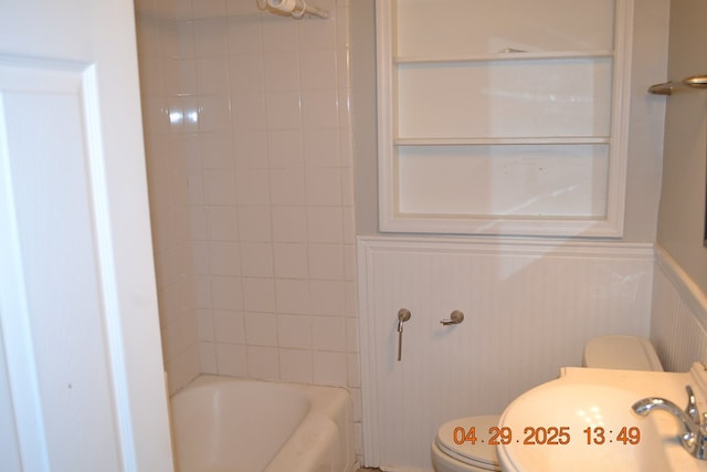 3836 Mulberry Dr, Columbus, GA 31907 - bathroom with toilet, a wainscoted wall, and a sink