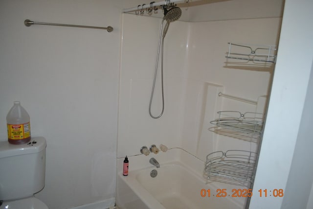 bathroom featuring toilet and bathing tub / shower combination