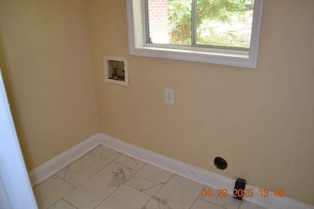 washroom with baseboards, laundry area, washer hookup, and marble finish floor