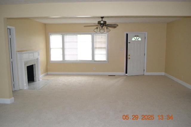 3836 Mulberry Dr, Columbus, GA 31907 - unfurnished living room featuring ceiling fan, light colored carpet, baseboards, and a fireplace