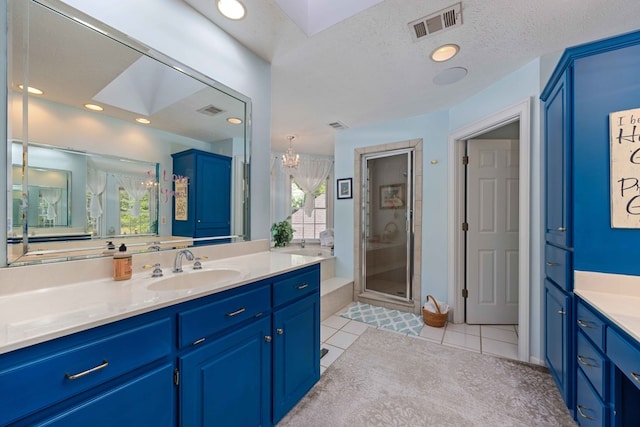 12225 County Line Rd, Midland, GA 31820 - bathroom featuring a stall shower, a skylight, tile patterned floors, vanity, and a chandelier