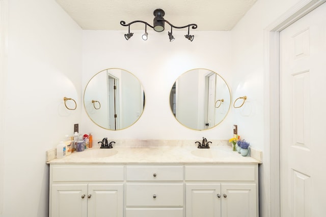 4524 Hedingham Ln, Columbus, GA 31907 - full bathroom featuring double vanity and a textured ceiling