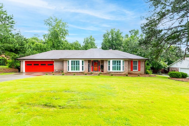 4524 Hedingham Ln, Columbus, GA 31907 - ranch-style home with asphalt driveway, a garage, a front yard, and brick siding