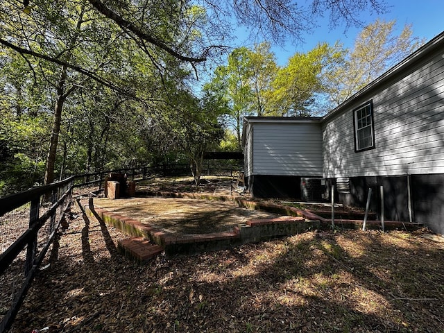 view of yard featuring central air condition unit