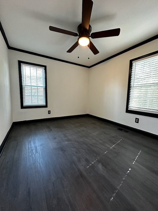 unfurnished room with dark hardwood / wood-style floors, ceiling fan, and ornamental molding