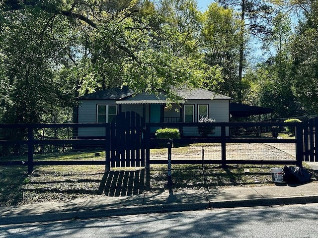 view of front of property featuring a carport