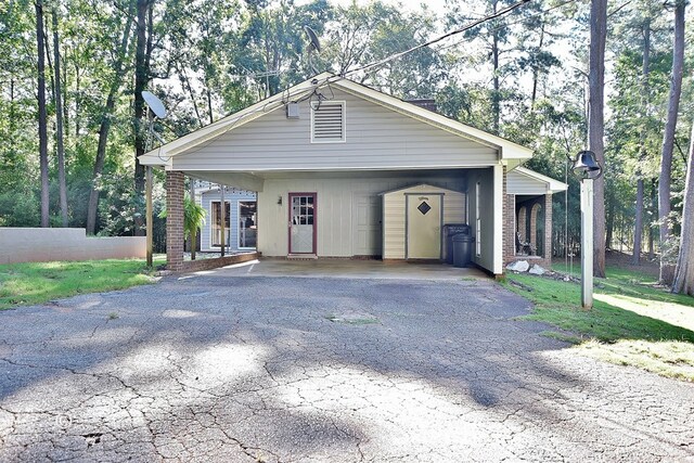 view of front of home with a carport