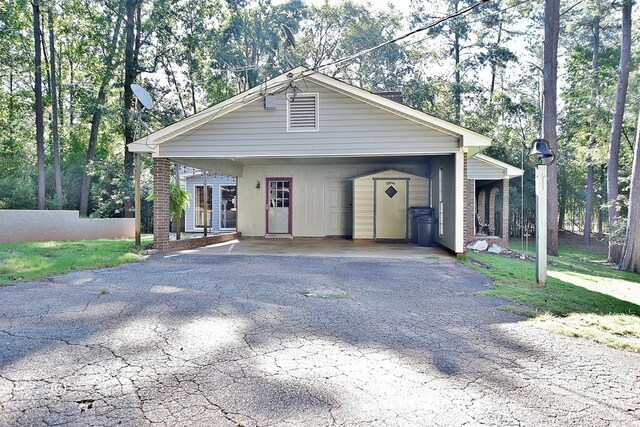 1237 Smith Rd, Fortson, GA 31808 - view of front facade with driveway and a carport