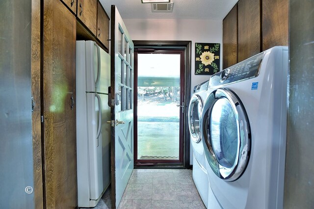 1237 Smith Rd, Fortson, GA 31808 - laundry room with washer and clothes dryer and cabinet space