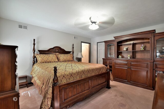 bedroom with ceiling fan and light colored carpet