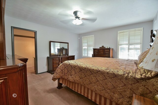 1237 Smith Rd, Fortson, GA 31808 - bedroom with light carpet, ceiling fan, and baseboards
