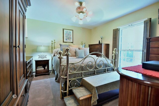 bedroom featuring ceiling fan and carpet