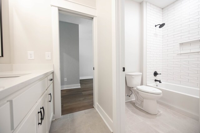 8409 Ripple Rdg, Columbus, GA 31904 - bathroom featuring vanity, toilet, shower / bathtub combination, baseboards, and tile patterned flooring