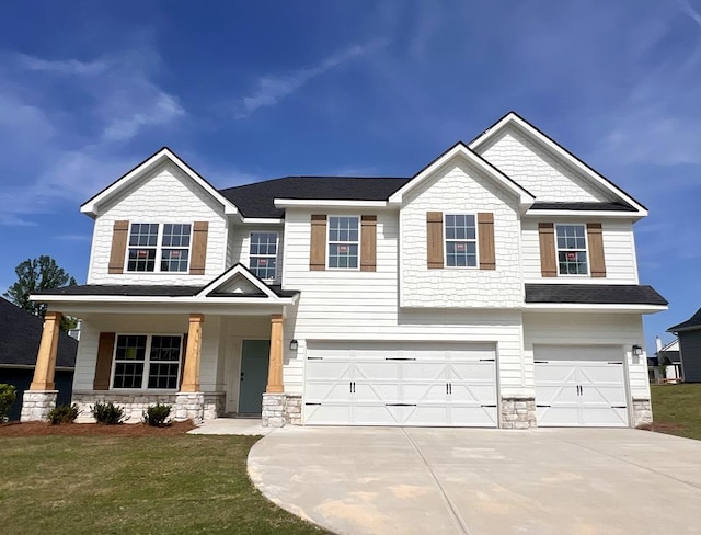 4043 Holstein Hl, Columbus, GA 31904 - view of front of house featuring driveway, stucco siding, and a garage