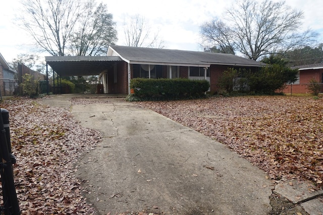 ranch-style house with a carport