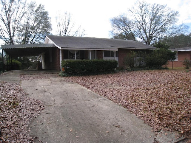 ranch-style house with a carport