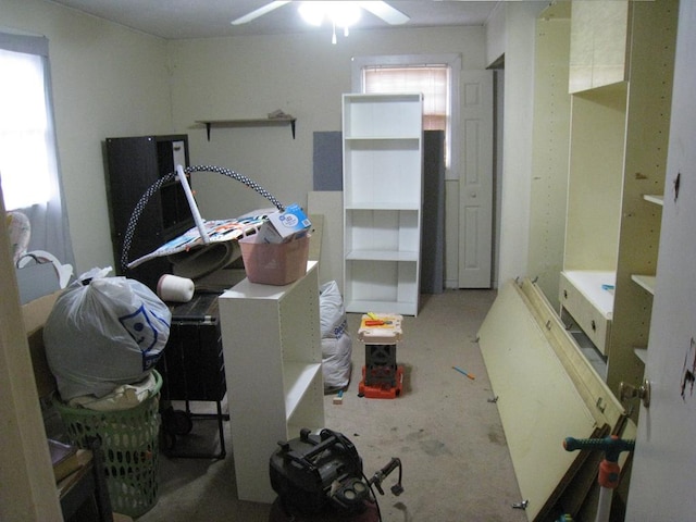 miscellaneous room featuring concrete flooring and ceiling fan