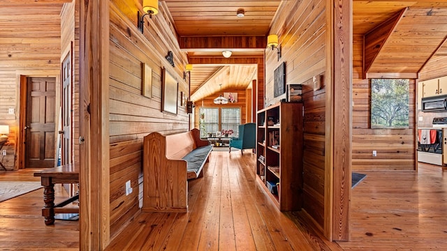 125 Brady Rd, Buena Vista, GA 31803 - hallway featuring wooden ceiling, wooden walls, wood-type flooring, and vaulted ceiling