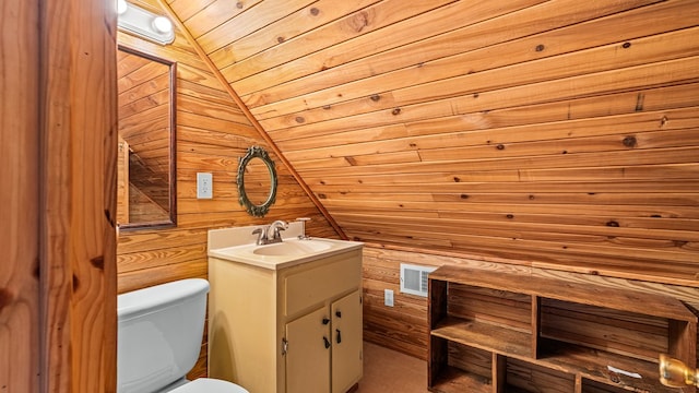 125 Brady Rd, Buena Vista, GA 31803 - bathroom featuring wooden walls, visible vents, toilet, wooden ceiling, and vanity