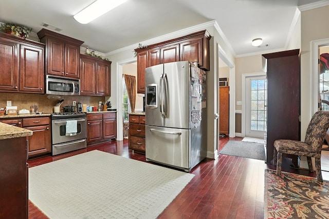 4256 Anglin Rd, Columbus, GA 31907 - kitchen featuring stainless steel appliances, ornamental molding, backsplash, dark wood-style flooring, and light stone countertops