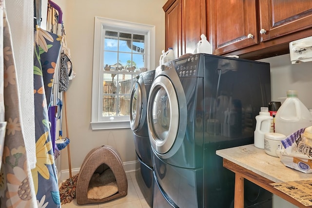 4256 Anglin Rd, Columbus, GA 31907 - laundry room with cabinet space, separate washer and dryer, and light tile patterned flooring