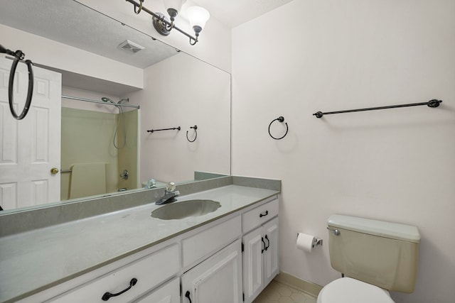 full bath featuring visible vents, walk in shower, vanity, baseboards, and toilet