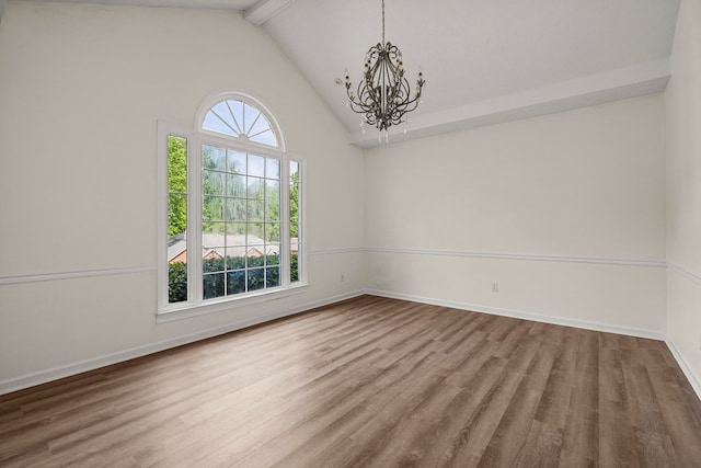 unfurnished room with beam ceiling, high vaulted ceiling, a chandelier, baseboards, and wood finished floors
