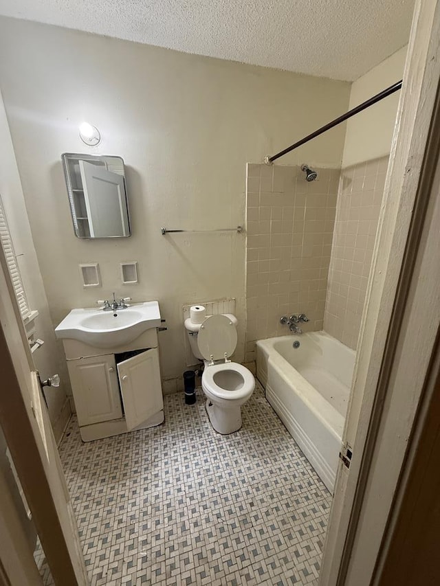 2436 Schaul St, Columbus, GA 31906 - bathroom featuring toilet, vanity, shower / bath combination, and a textured ceiling